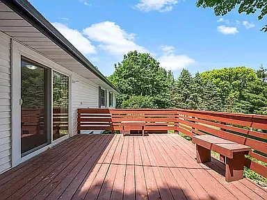 Patio door off kitchen to deck and fenced area