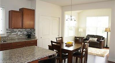 Breakfast area open to the sunroom.
