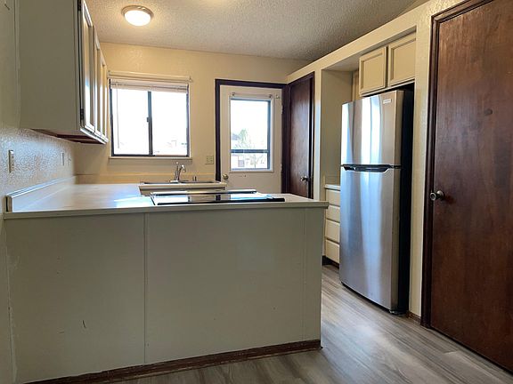Bright kitchen with upper balcony access