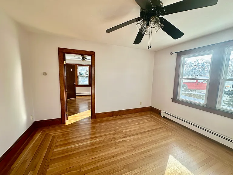 Living area looking into bedroom