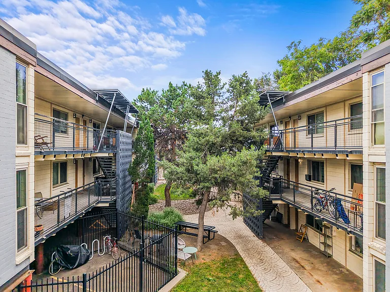 Private Patios and Exterior Entrance for all Units. Shared gated yard, communal space, BBQ with tables and chairs.