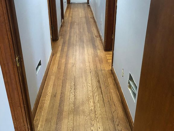 Hallway view from master bedroom to bathroom and two bedrooms