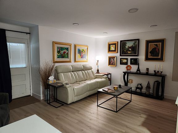 TV/living area. Couch has electric reclining side seats and charging station in the center pull down.