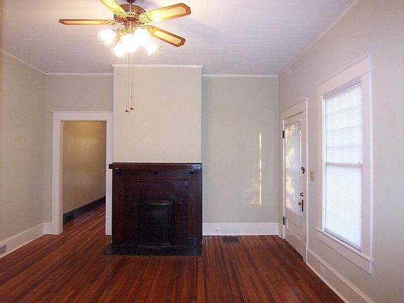 Living room w/ fireplace mantel