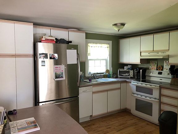 Kitchen featuring double oven and dishwasher