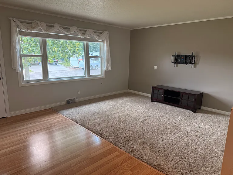 Front room of the home, facing out to the street and driveway side of this home.