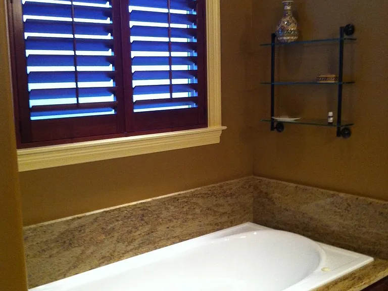 Jacuzzi style bathtub, with separate shower stall.