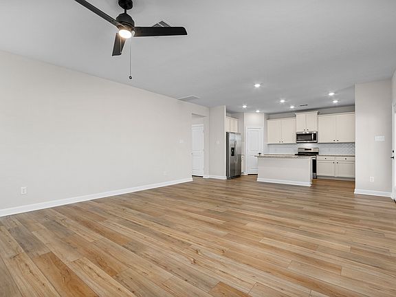 The dining room is open to the kitchen and family room.