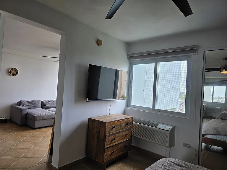 Primary bedroom dresser and brand new flat screen TV