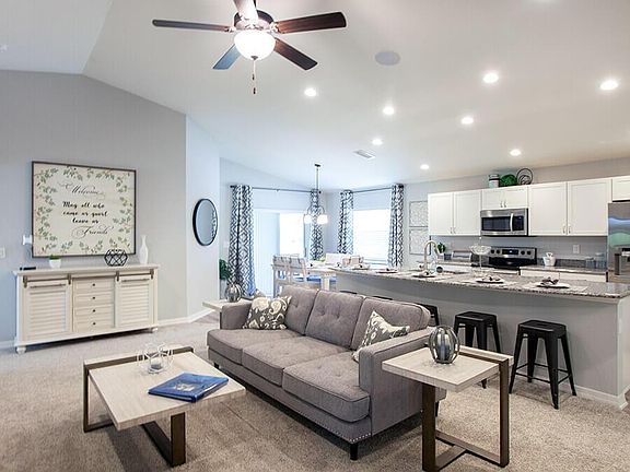 Enjoy an open living area, ideal for gathering with family and friends - Parker by Highland Homes