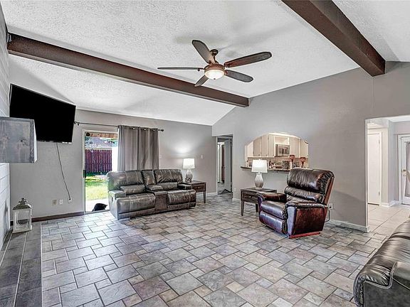 Spacious Family Room! Tile Floors, Hi Beamed Ceilings, Recently Painted!