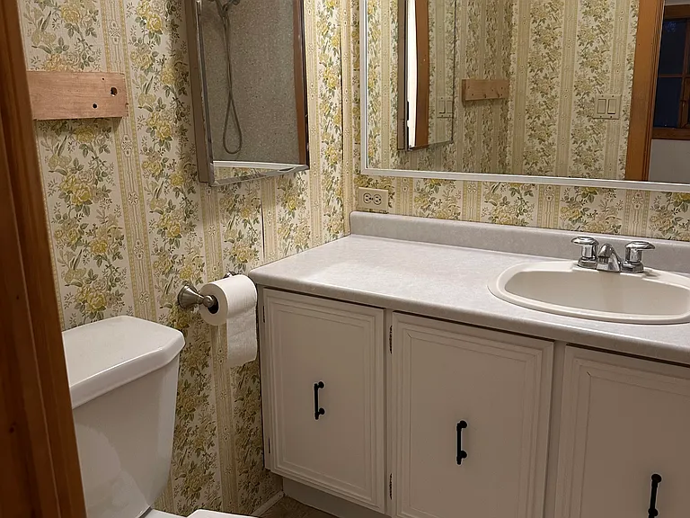 North bathroom (includes shelf system and full tub/shower, not pictured).