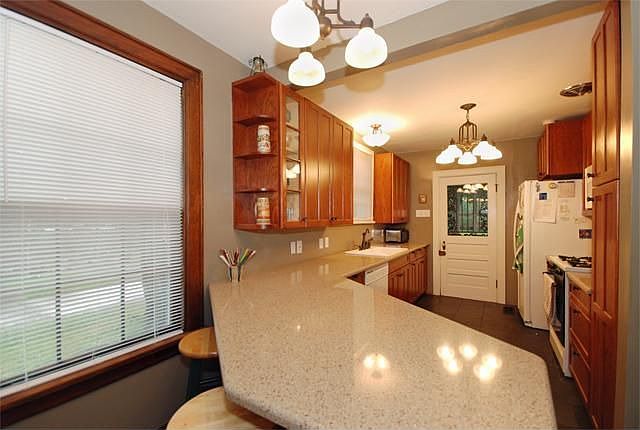 Newly renovated kitchen with quartz counters & Brazilian black slate floor