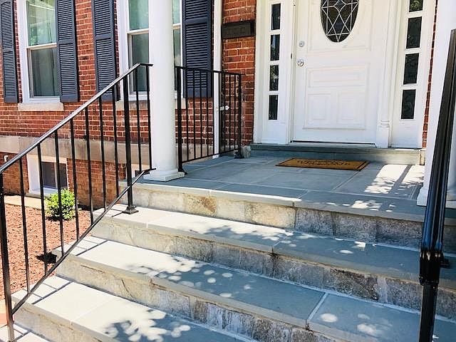 Stone Front Porch and Iron Railing