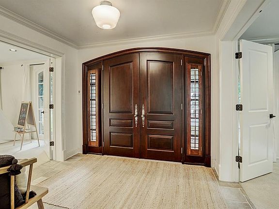 Inviting front foyer with double door