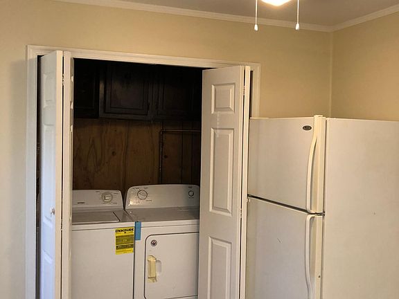 Kitchen with washer and dryer