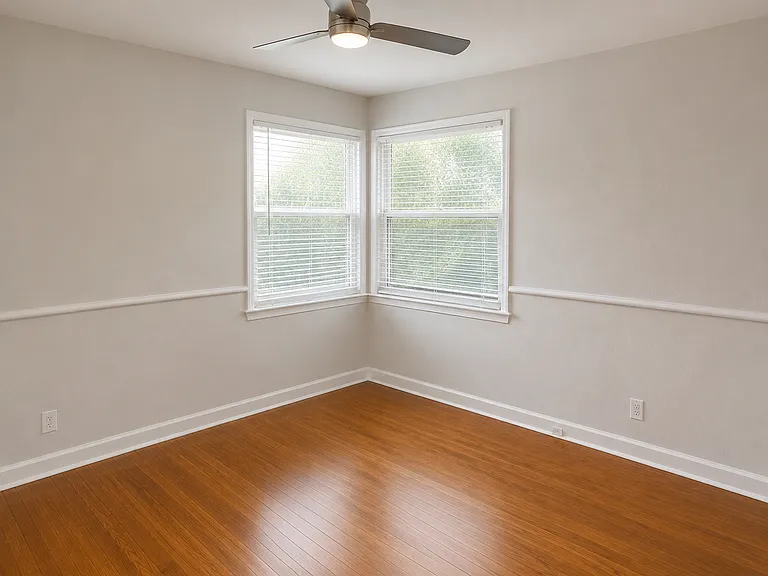 Bedroom with refinished hardwood floors