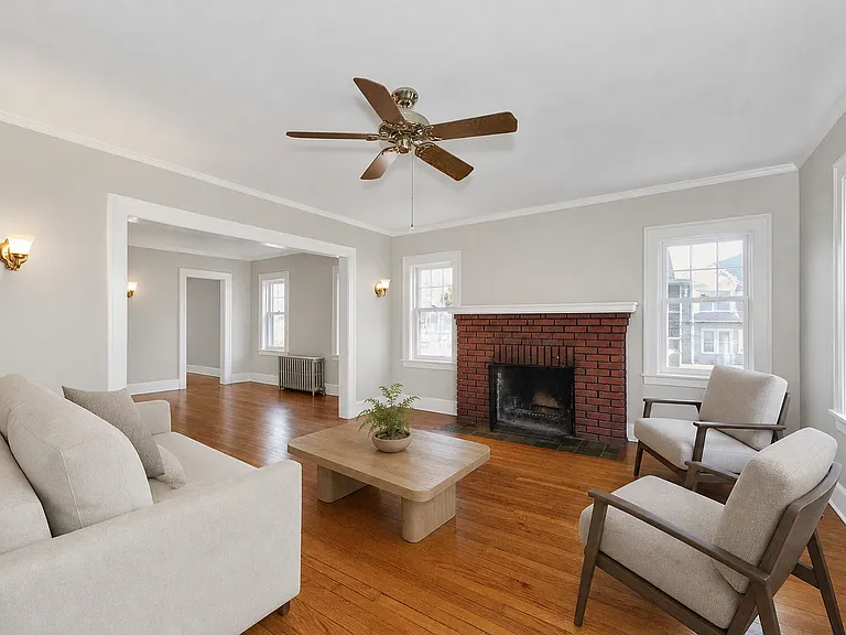 AI Rendering to show living / dining room color and possible furniture placement.