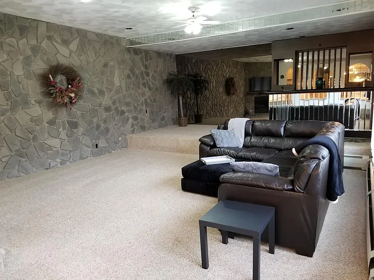Large Living Room with bar and gas fireplace.