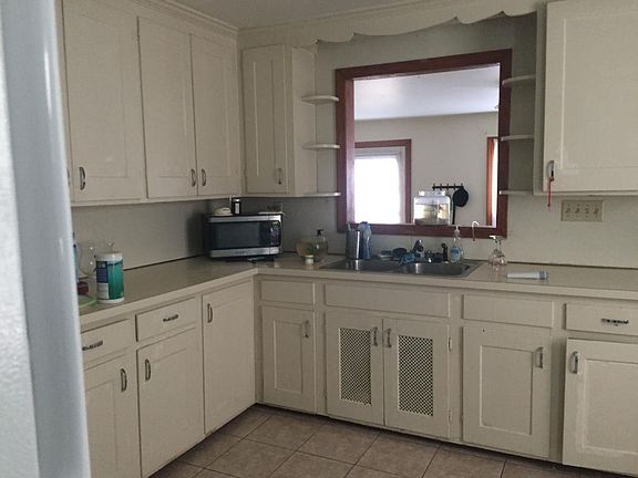 kitchen with opening to den/tv/study