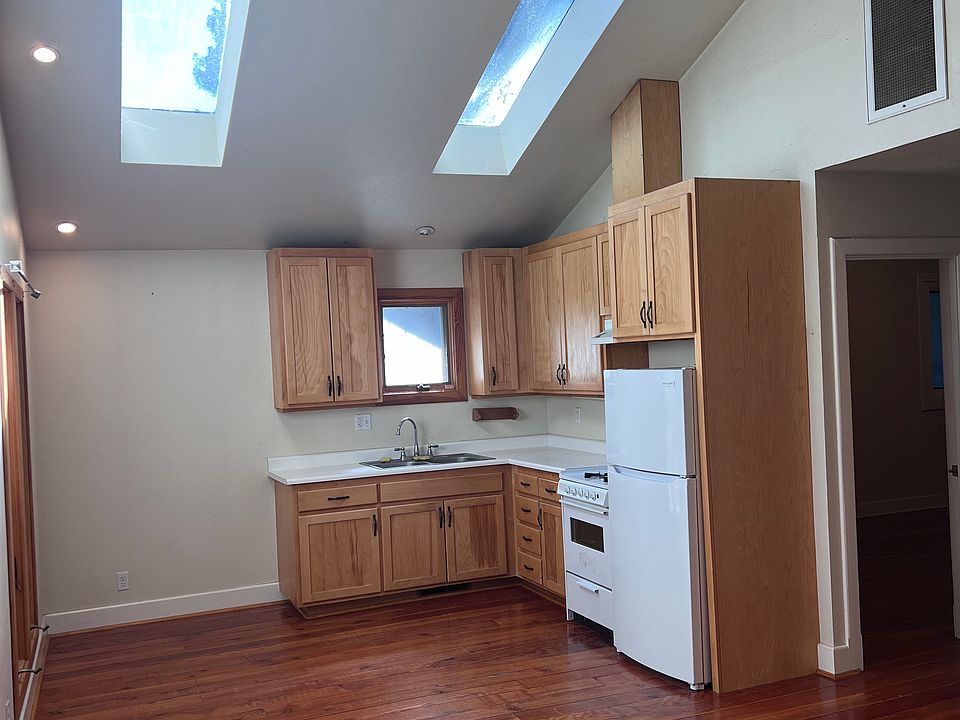 Kitchen and living space large deck adjoins