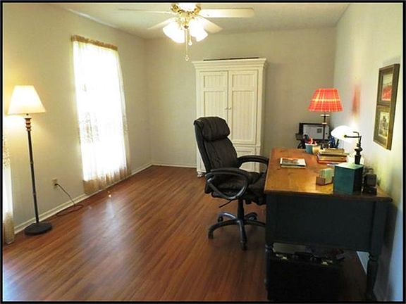 FORMAL LIVING ROOM OR STUDY WITH WOOD LAMINATE FLOORS