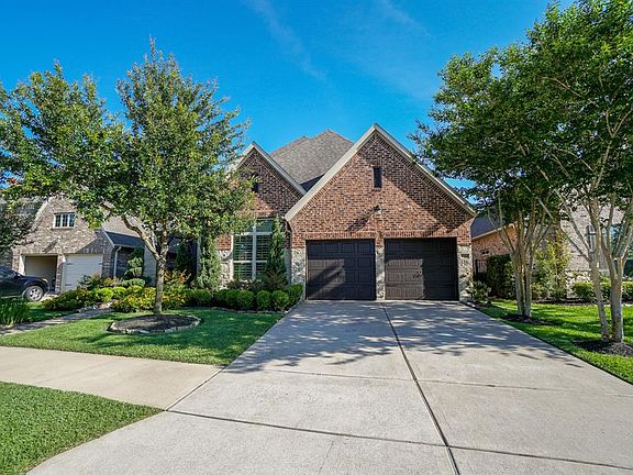 Curb appeal galore! Immaculate landscaping and mature trees give this charming home a welcoming feel from the moment you pull up.