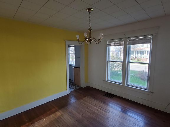 Dining room overlooking gardened side yard.