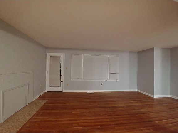 Large living room and the bay window looks out to the large backyard.