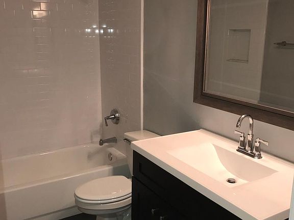 Updated full bath, tile floor, and enhanced lighting