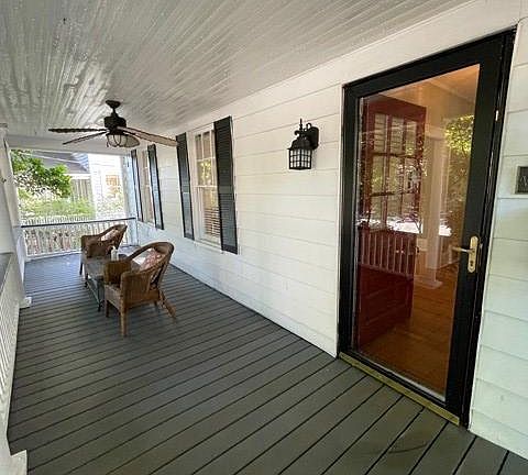 Porch recently replaced with gray Trex synthetic lumber for durability and ease of maintenance.