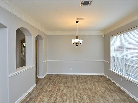 Another view of dining room with large window