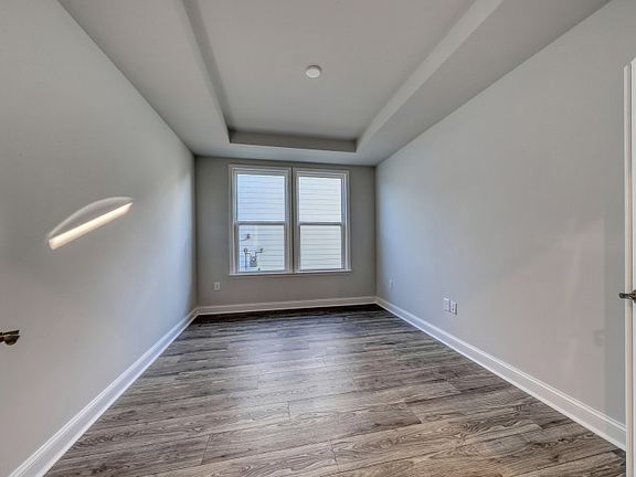 The desirable modern flex room with French doors can be utilized as a private study or task room.