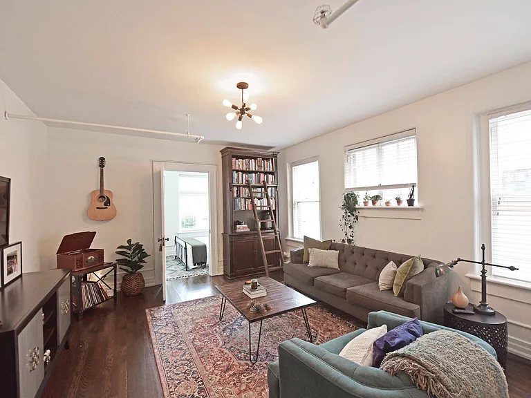 Spacious living room with hardwood-style flooring