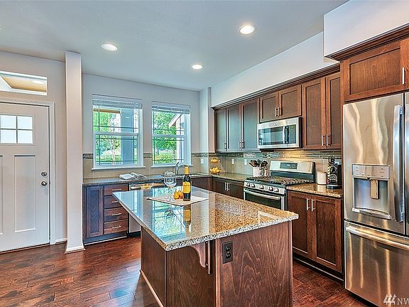 Well appointed kitchen, GE stainless steel appliances, granite slab.