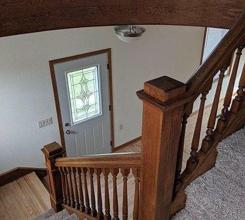 Front door and entry area at bottom of staircase