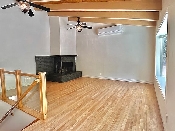 Upstairs informal living room and fireplace