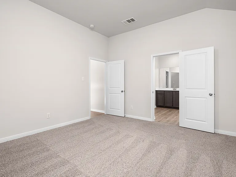 The master suite has a large bedroom, ensuite bathroom and walk-in closet.