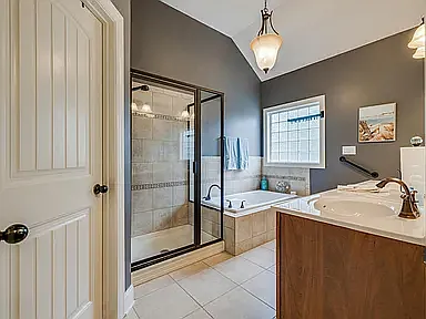 Primary Bathroom with Separate Soaking Tub and Tiled Shower