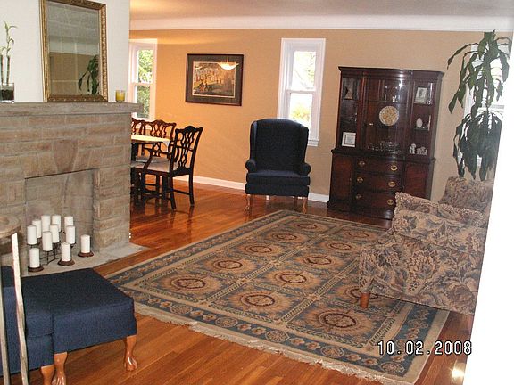 Gleaming honey hardwood floors, gas frpl, lg. picture window for lots of light