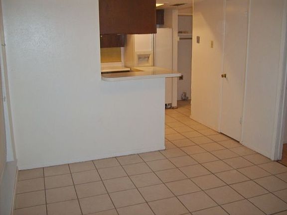 Tiel throughout dining room and kitchen.