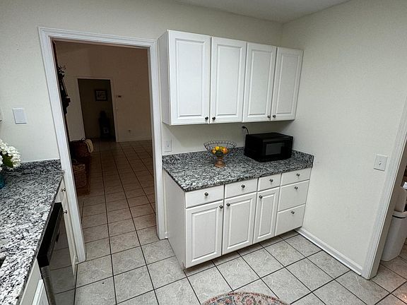 Kitchen with new stainless appliances and granite counters