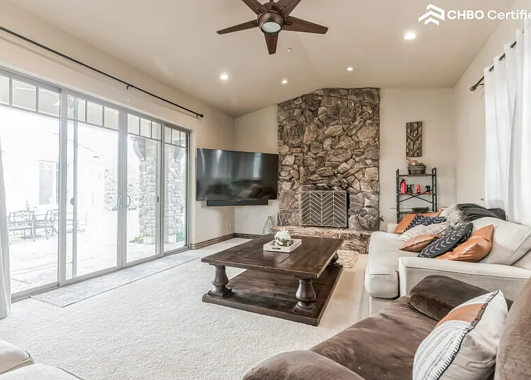 Living rm with wood burning fireplace