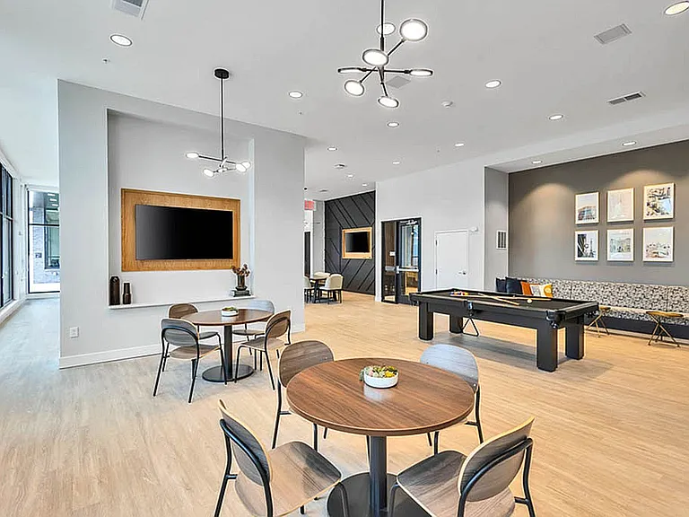 Community Lounge Featuring a Pool Table
