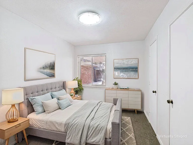 Bedroom 2 offers new carpet and neutral paint, and two closets