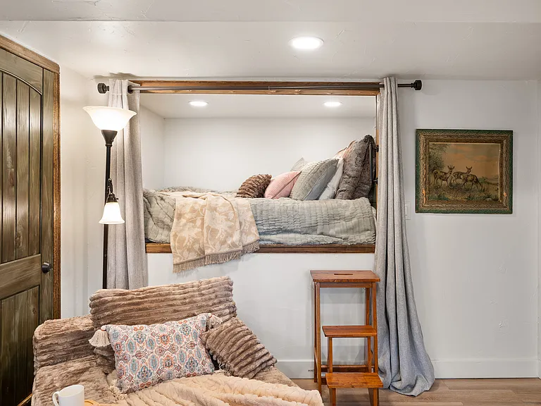 High quality queen bed with black out curtains, charging ports, shelf, lights and outlets