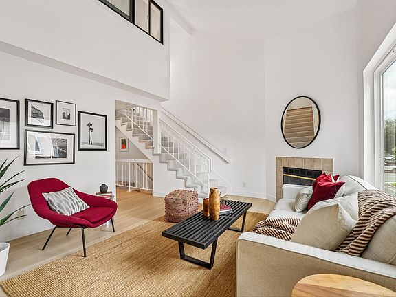 Living room with high ceilings and abundant sunlight
