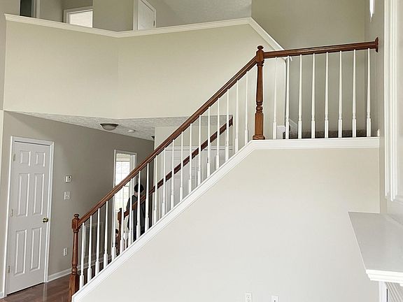 Open floor plan with new carpet and fresh paint.