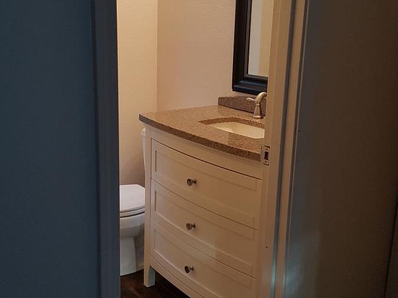 Half bath featuring new vanity