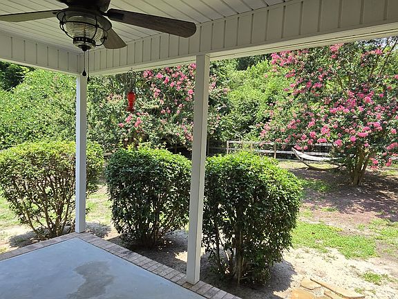 Large covered porch with beautiful views of Crepe Myrtle trees